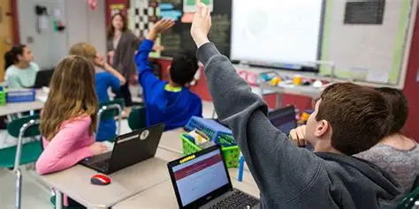 Students with Chromebooks in classroom